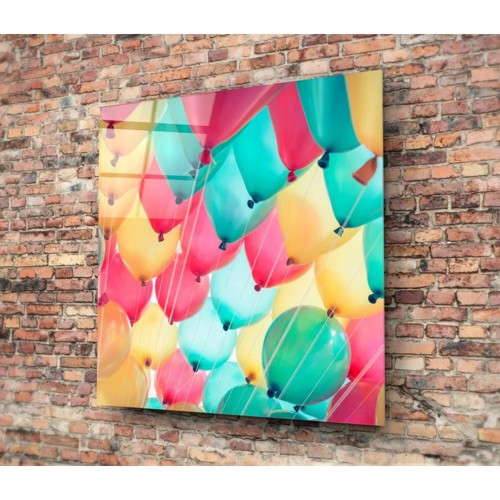 Vibrant multicolored balloon glass wall art on brick wall