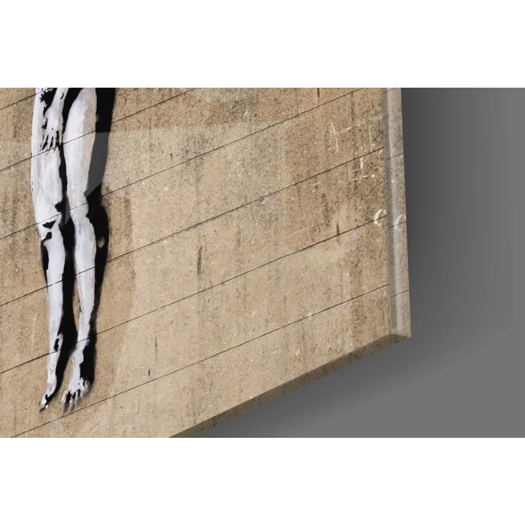 Minimalist Banksy stencil legs graffiti on beige concrete wall art