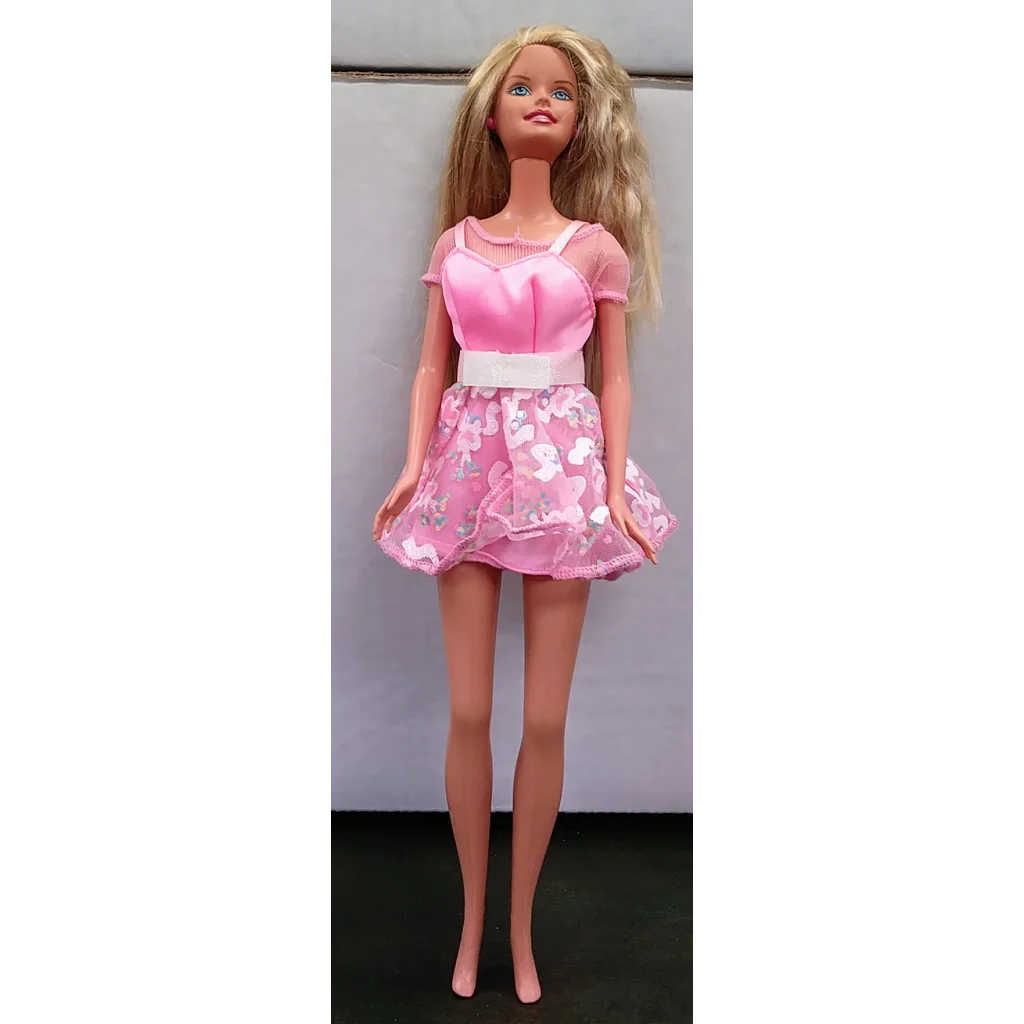Vintage 1995 Tea Party Barbie doll in pink floral dress with blonde hair