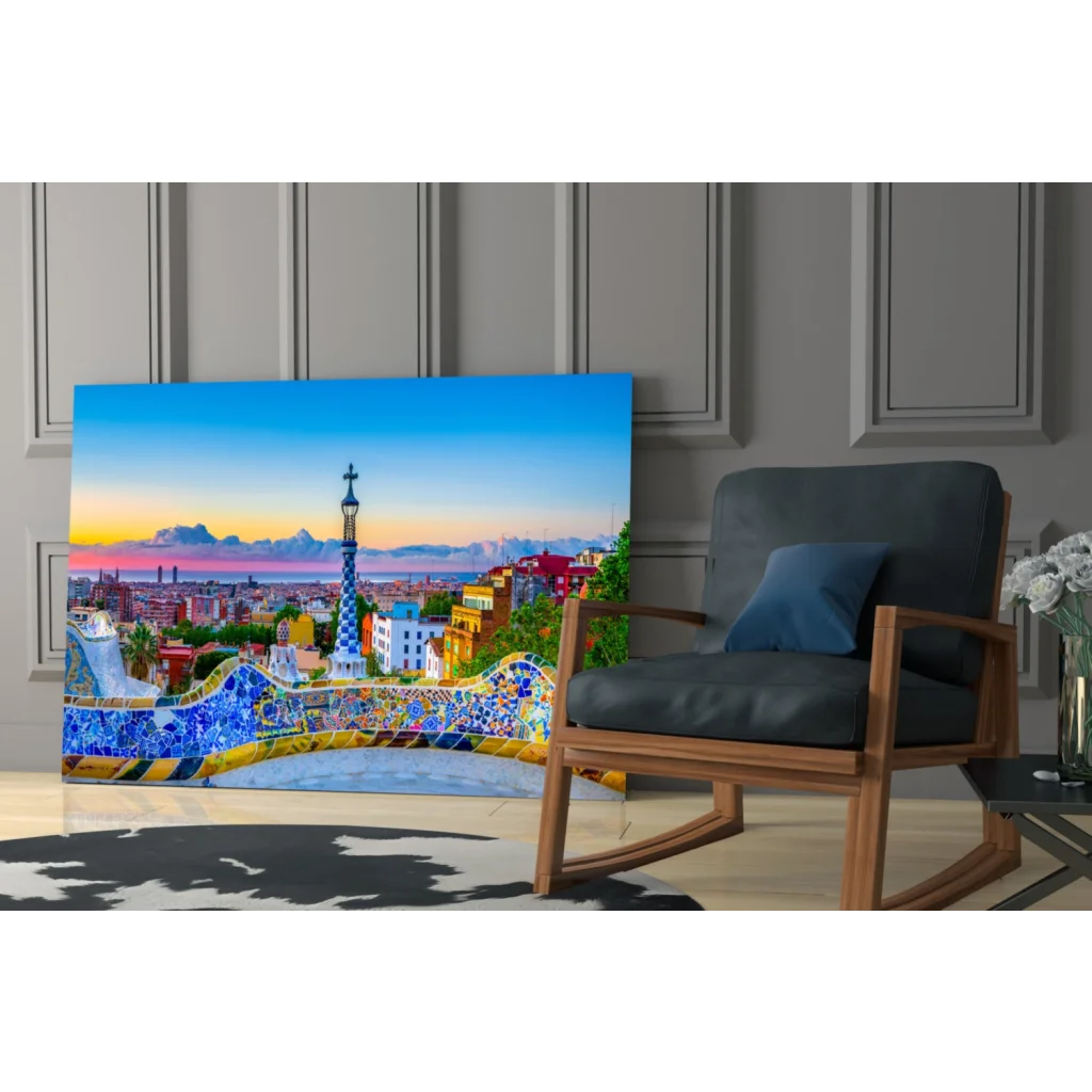 Vibrant Park Güell mosaic glass wall art with blue bench and sunset tower