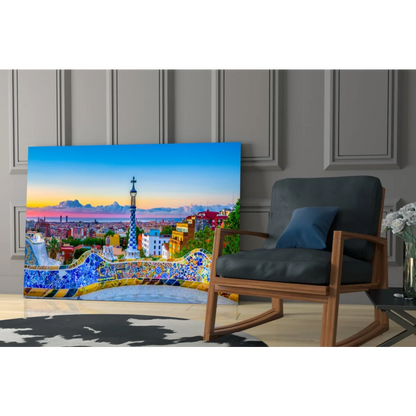 Vibrant Park Güell mosaic glass wall art with blue bench and sunset tower