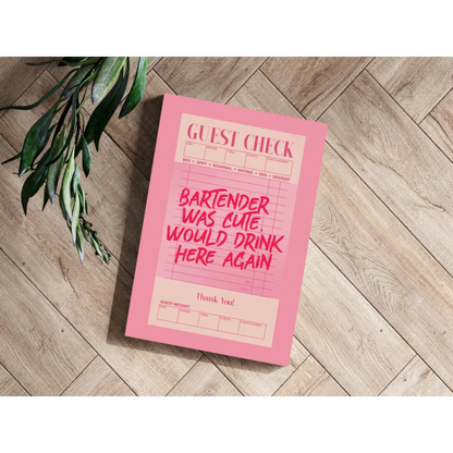 Pink guest check pad with white grid lines on wooden floor, cute bartender print