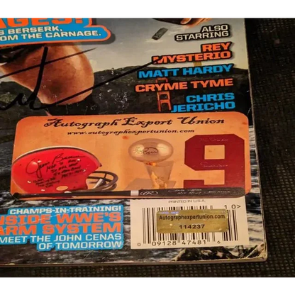 Batista signed WWE magazine with autographs and authentication sticker for collectors