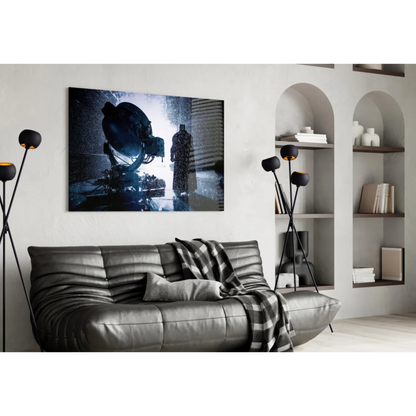 Black leather sofa with plaid throw on Batman Rainstorm glass wall art