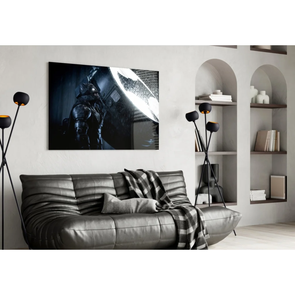 Epic Batman armor glass wall art with glowing symbol on black leather sofa
