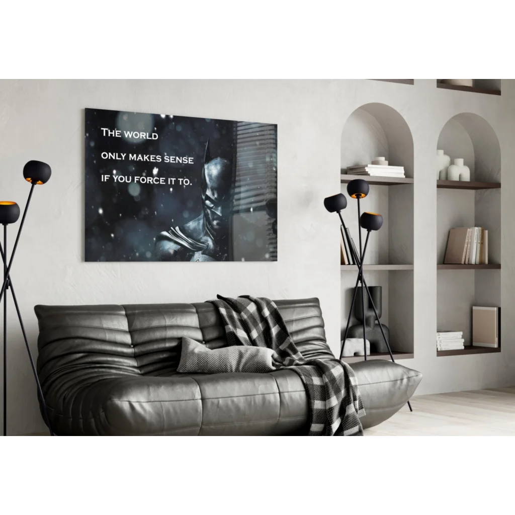 Black leather sofa with plaid blanket on Batman glass wall art