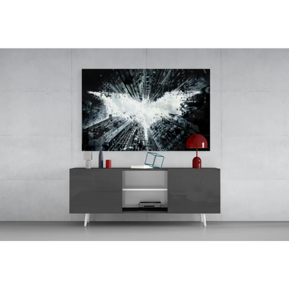 Black and white Batman logo exploding over cityscape on glass wall art