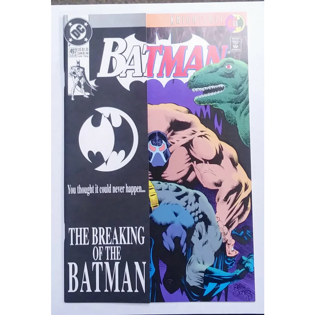 Batman Issue 497 comic cover with Bane breaking Bat, green dinosaur and bat symbol