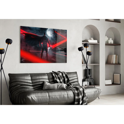 Black leather sofa with tufted cushions and plaid throw under Batman moon wall art