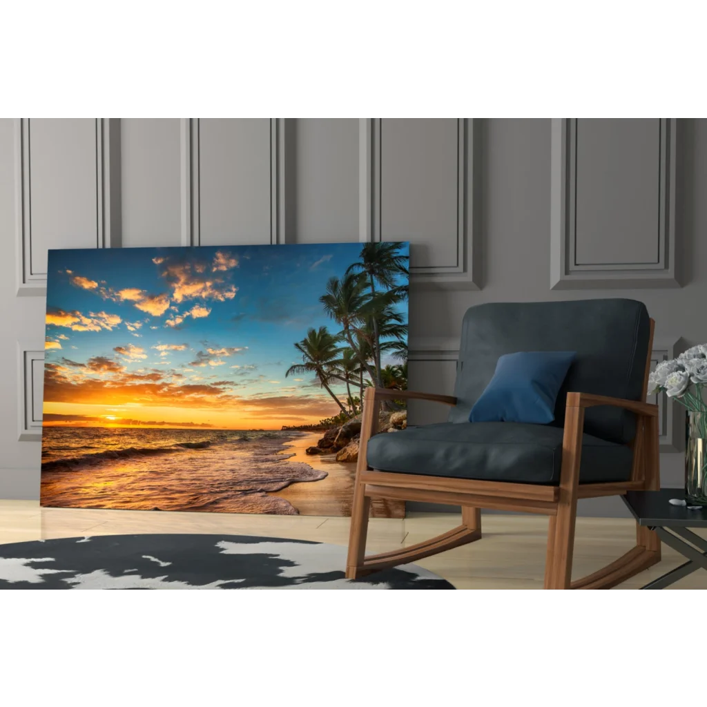 Tropical beach sunset glass wall art canvas print with vibrant orange and blue hues, palm trees, and ocean waves