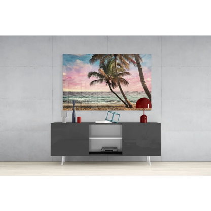 Vibrant tropical paradise glass wall art of leaning palm trees on sunset beach