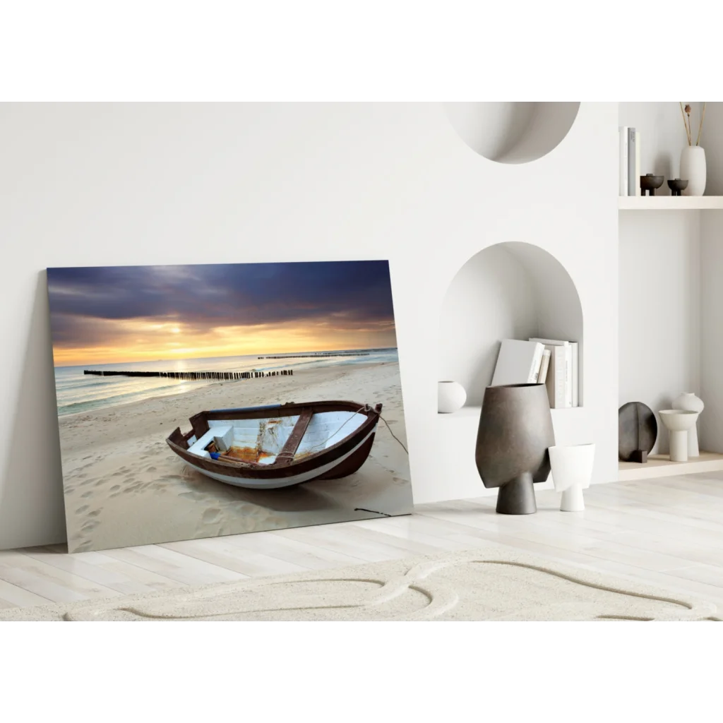 Weathered rowboat on beach under sunset sky in glass wall art print