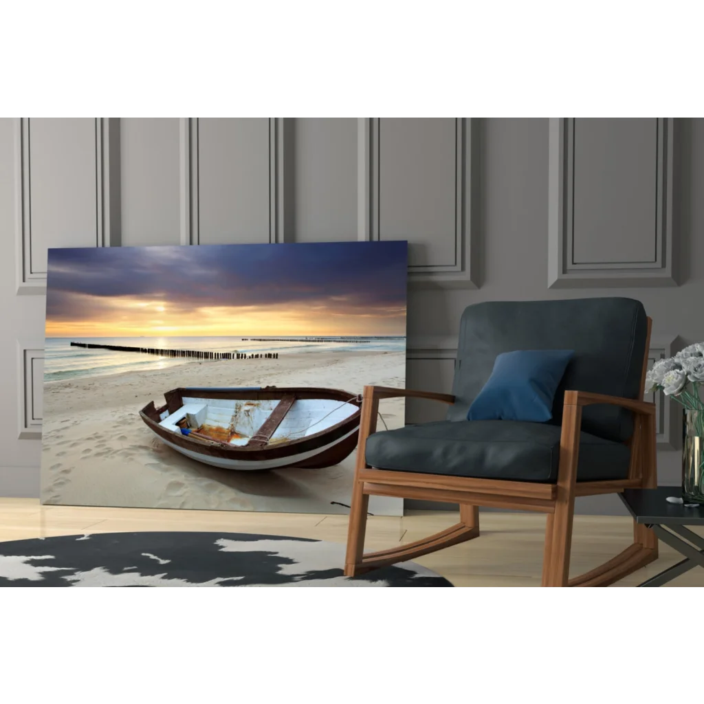 Beige brown wooden rowboat on sandy beach at sunset glass wall art