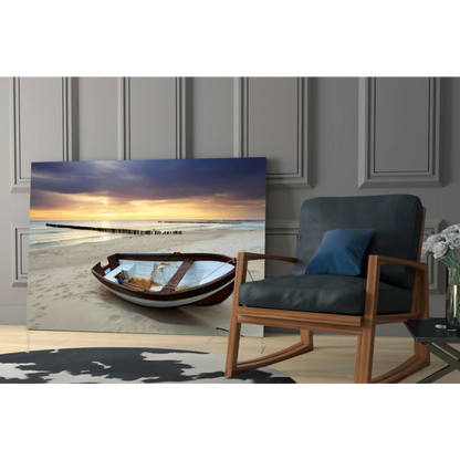 Beige brown wooden rowboat on sandy beach at sunset glass wall art