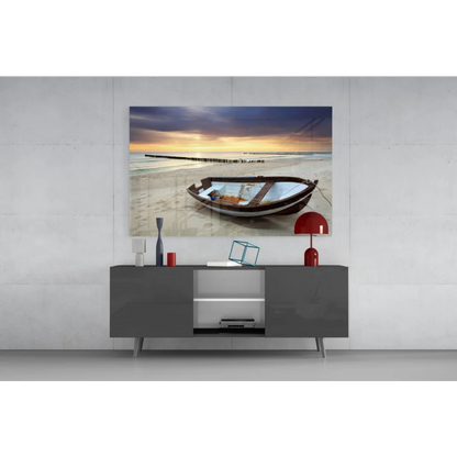 Weathered rowboat on beach at sunset glass wall art canvas print