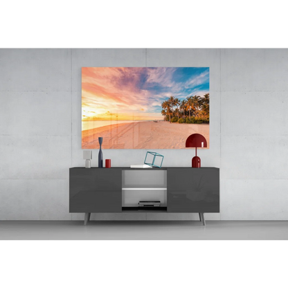 Tropical sunset glass wall art with palm trees and vibrant sky