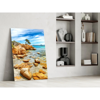 Vibrant tropical paradise glass wall art with turquoise waters and golden rocks