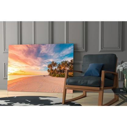 Tropical sunset glass wall art with palm trees and vibrant sky