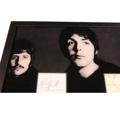 Black-and-white Beatles photo with Paul McCartney and John Lennon in autographed cut music display