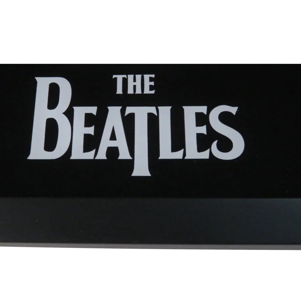 Black rectangular Beatles band autographed sticker in framed display