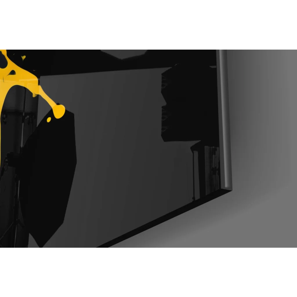 Bold yellow paint splatter on sleek dark gray glass wall art