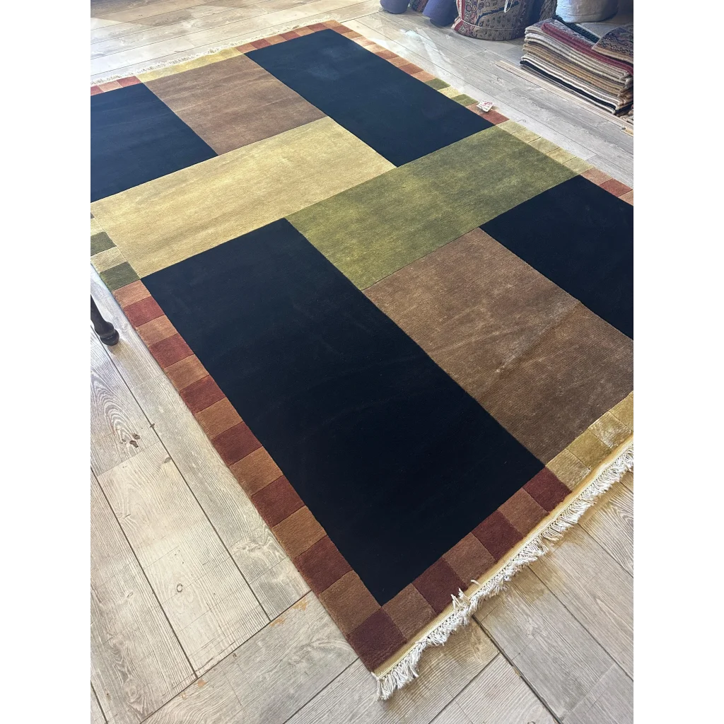 Contemporary hand-knotted abstract area rug, bold geometric patchwork colors, wool from India