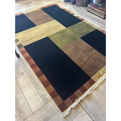 Contemporary hand-knotted abstract area rug, bold geometric patchwork colors, wool from India