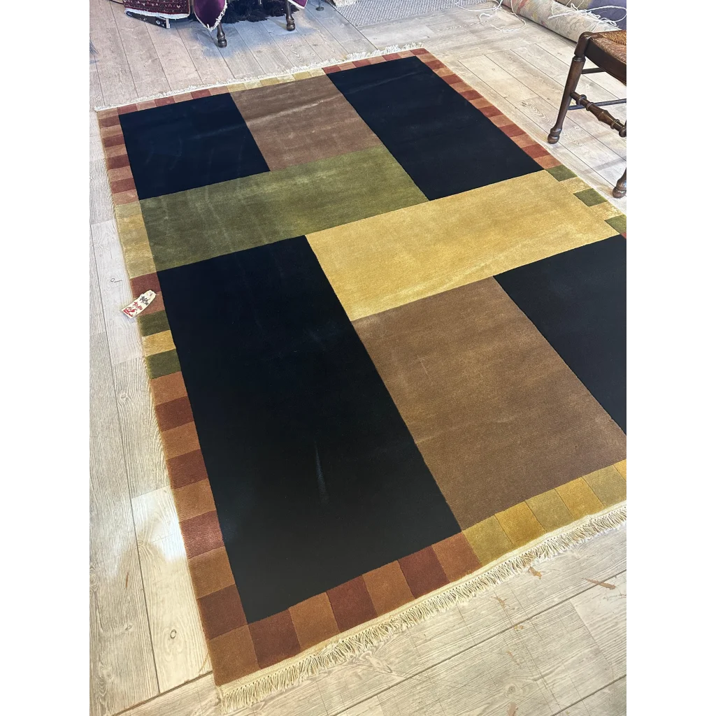 Abstract geometric wool rug hand-knotted in India, bold colors field view, excellent condition