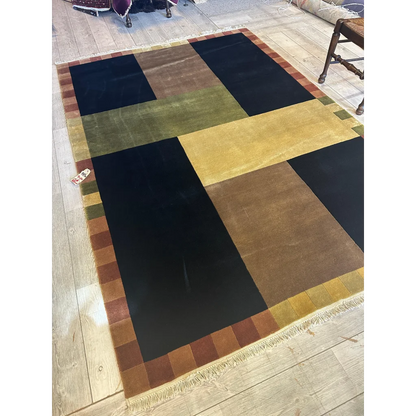 Abstract geometric wool rug hand-knotted in India, bold colors field view, excellent condition