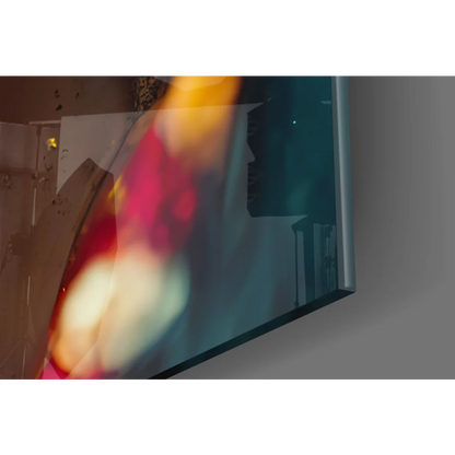 Stunning glass wall art portrait of sleek flat-screen TV with vibrant blurred colors
