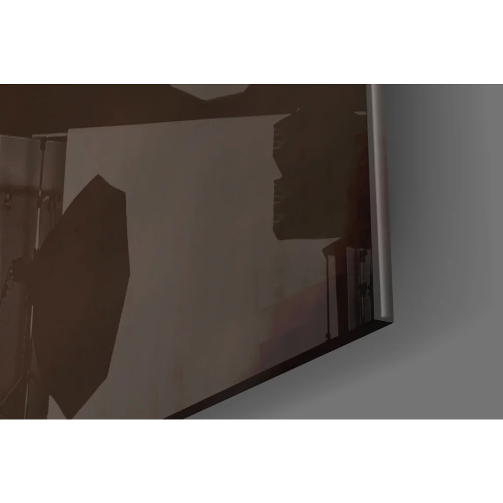 Vibrant orange bird glass wall art on sleek silver-framed monitor