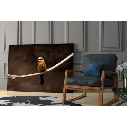 Vibrant orange bird canvas wall art on moody dark branch background