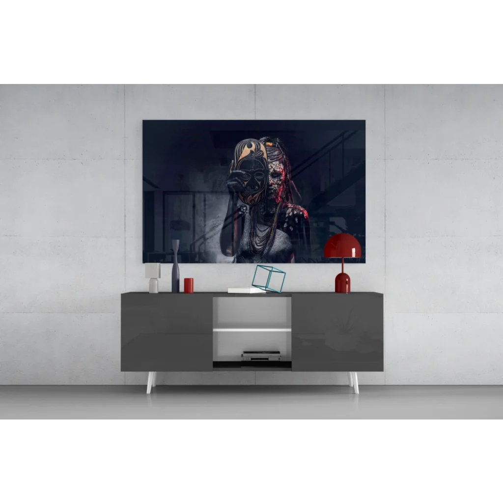 Stylized dark predator mask wall art on gray console