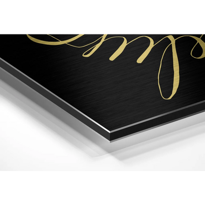Black metal plaque with gold cursive on brushed aluminium dibond wall art