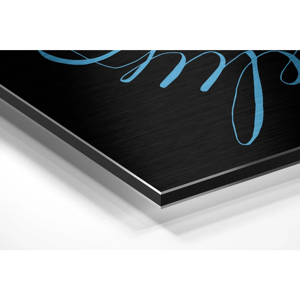 Brushed aluminium dibond wall art with teal cursive script on black metal print