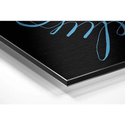 Brushed aluminium dibond wall art with teal cursive script on black metal print