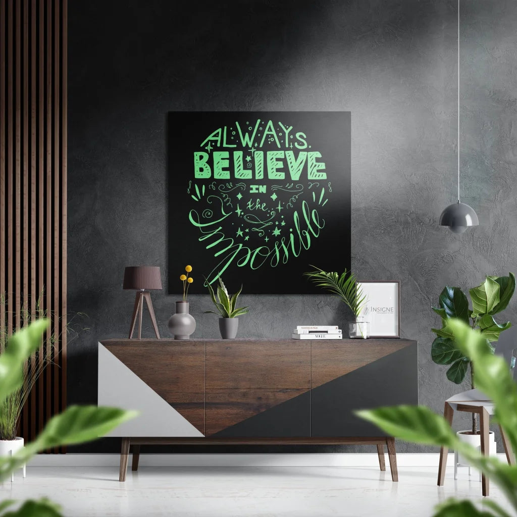 Black and white geometric wall art with green Always Believe in Impossible text on brushed aluminium dibond