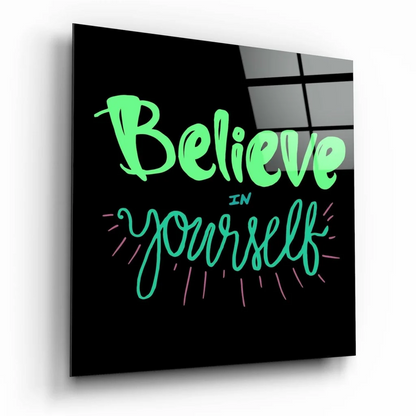 Vibrant neon green Believe in Yourself glass wall art on black with pink accents