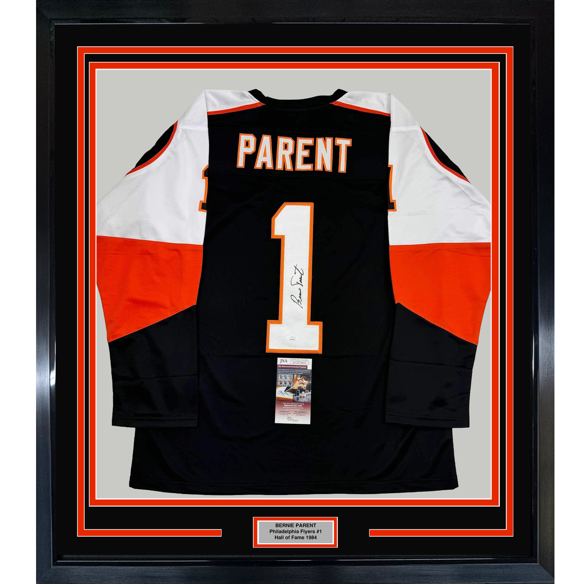 Framed black Philadelphia Flyers hockey jersey #1 with "PARENT" nameplate, signed, displaying front view with red and white sleeve panels and JSA authentication certificate.
