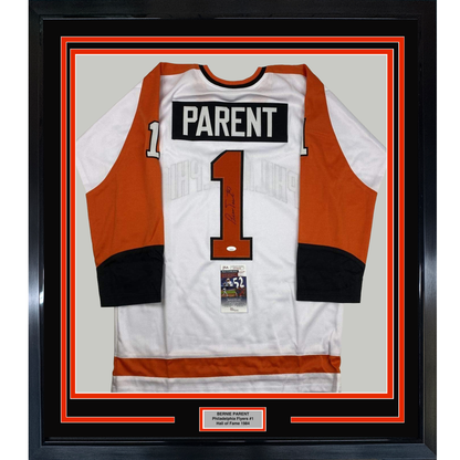 Framed white and orange Philadelphia Flyers hockey jersey number 1 with "PARENT" nameplate, displayed flat against beige backing with authentication certificate visible.