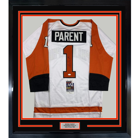 Framed white and orange Philadelphia Flyers hockey jersey number 1 with "PARENT" nameplate, displayed flat against beige backing with authentication certificate visible.