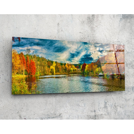 Rectangular glass wall art mounted on concrete wall displaying autumn landscape with colorful trees, blue river, and cloudy sky.