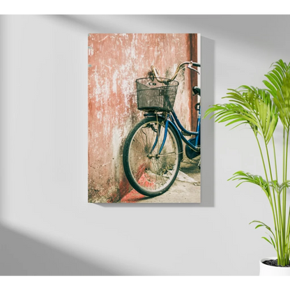 Blue bicycle with black basket against pink wall on Insigne aluminum print