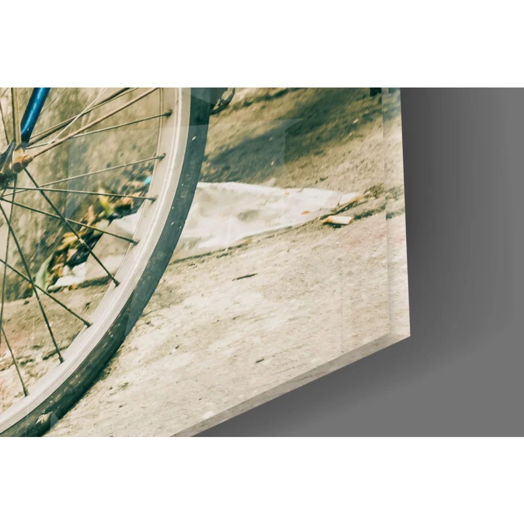 Glass wall art print of bicycle wheel with thin spokes and blue frame