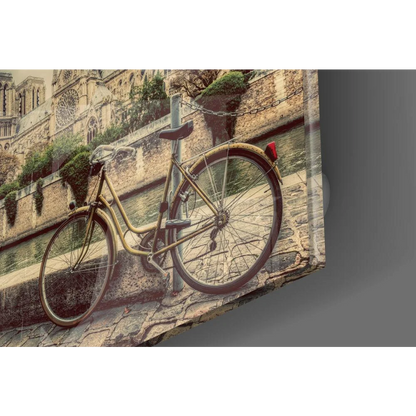 Vintage yellow bicycle by canal on glass wall art print