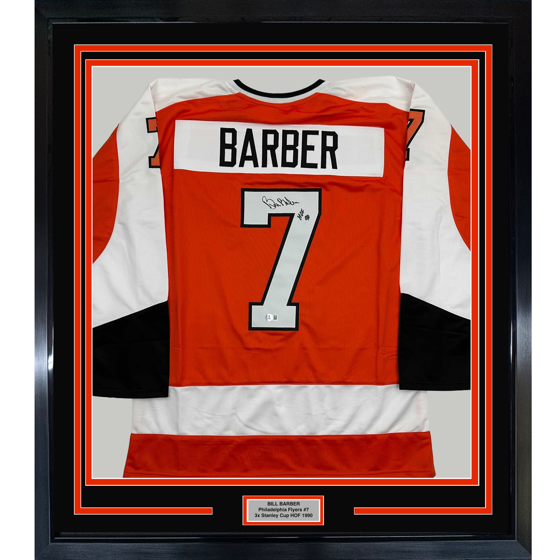 Framed red and white Philadelphia Flyers hockey jersey number 7 with "BARBER" nameplate and autographed signature, displayed against black matting with identifying plaque.