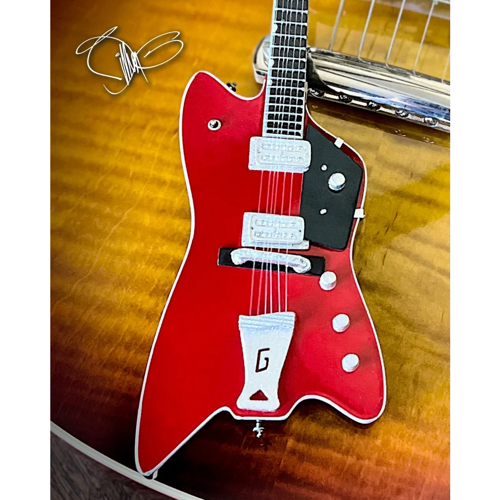 Red Billy F Gibbons Axe Heaven mini Explorer guitar with adjustable A-frame stand