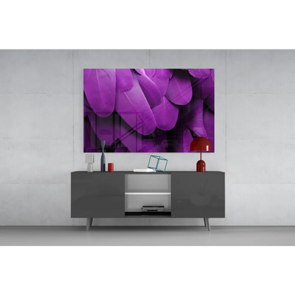 Vibrant purple feather wall art canvas print above gray console