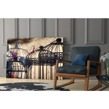 Stunning black metal birdcage wall art with flowers and ornate lattice on warm background