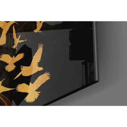 Stunning glass wall art with black framed golden bird silhouettes in flight